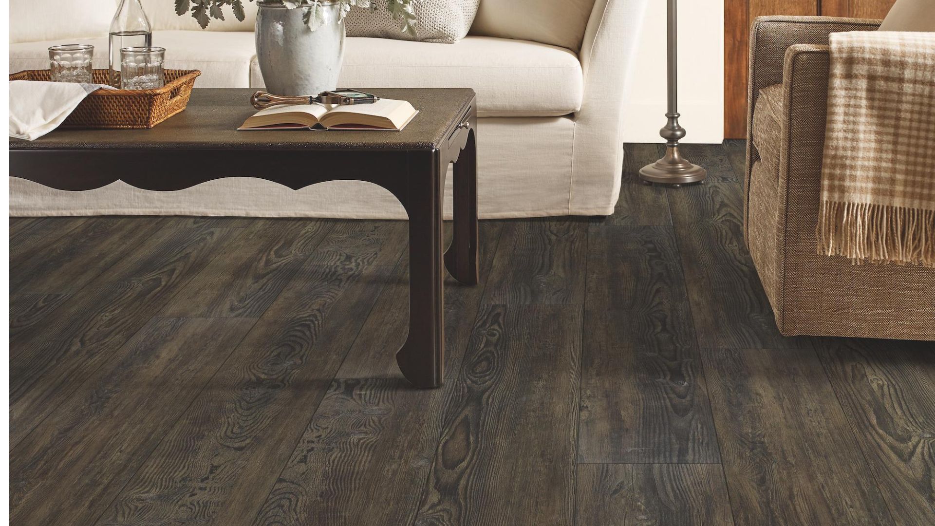 dark stained luxury vinyl plank flooring in a charming traditional living room